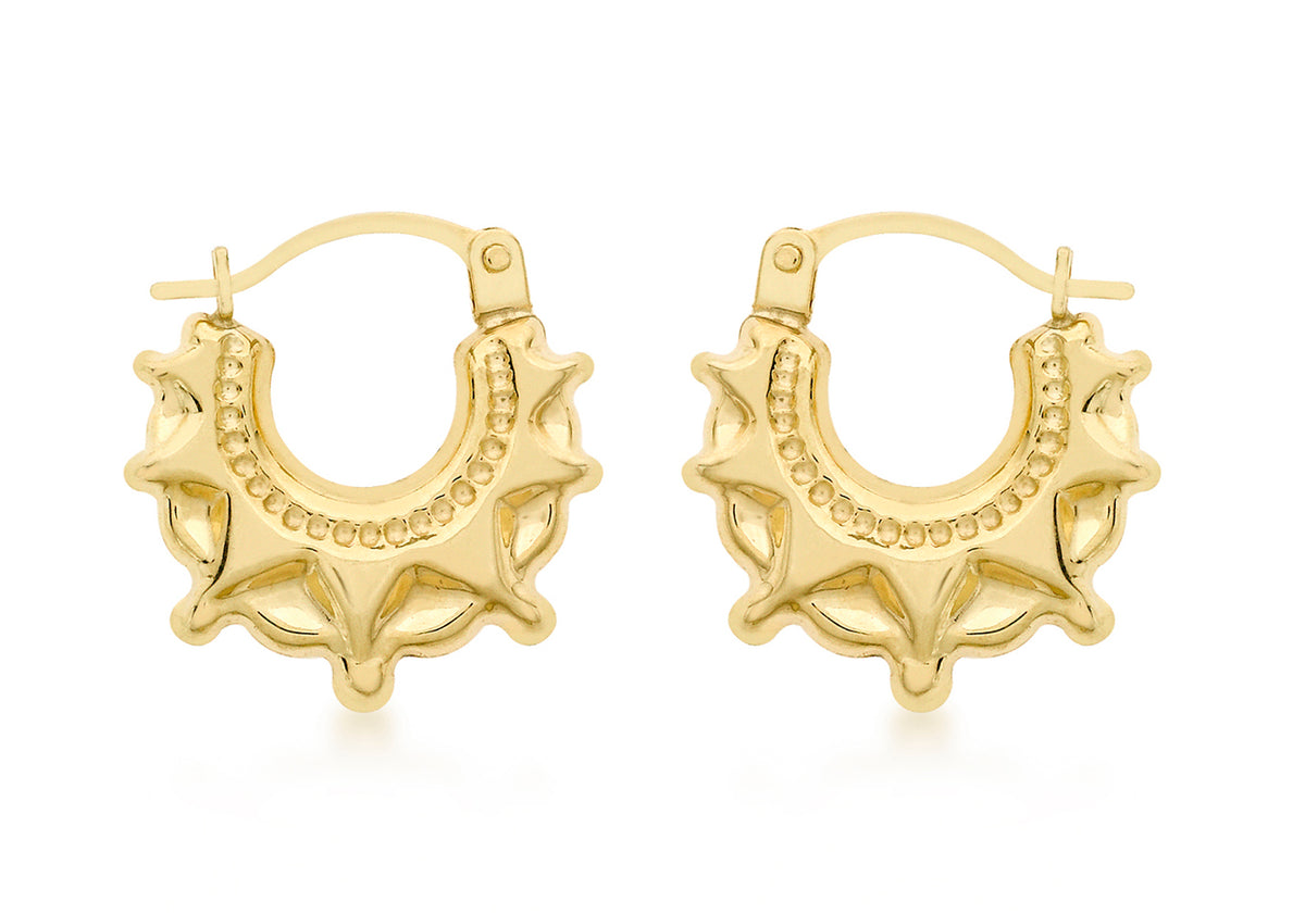 A pair of gold crescent moon hoop earrings with textured, star-like points and a beaded inner border, shown on a clean white background.
