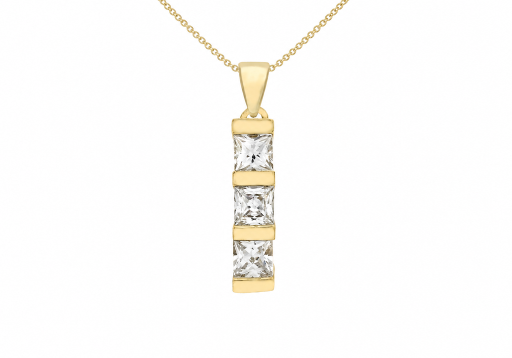 A gold pendant necklace featuring three vertically aligned princess-cut clear stones in a gold bezel setting, suspended from a delicate gold chain against a plain white background.