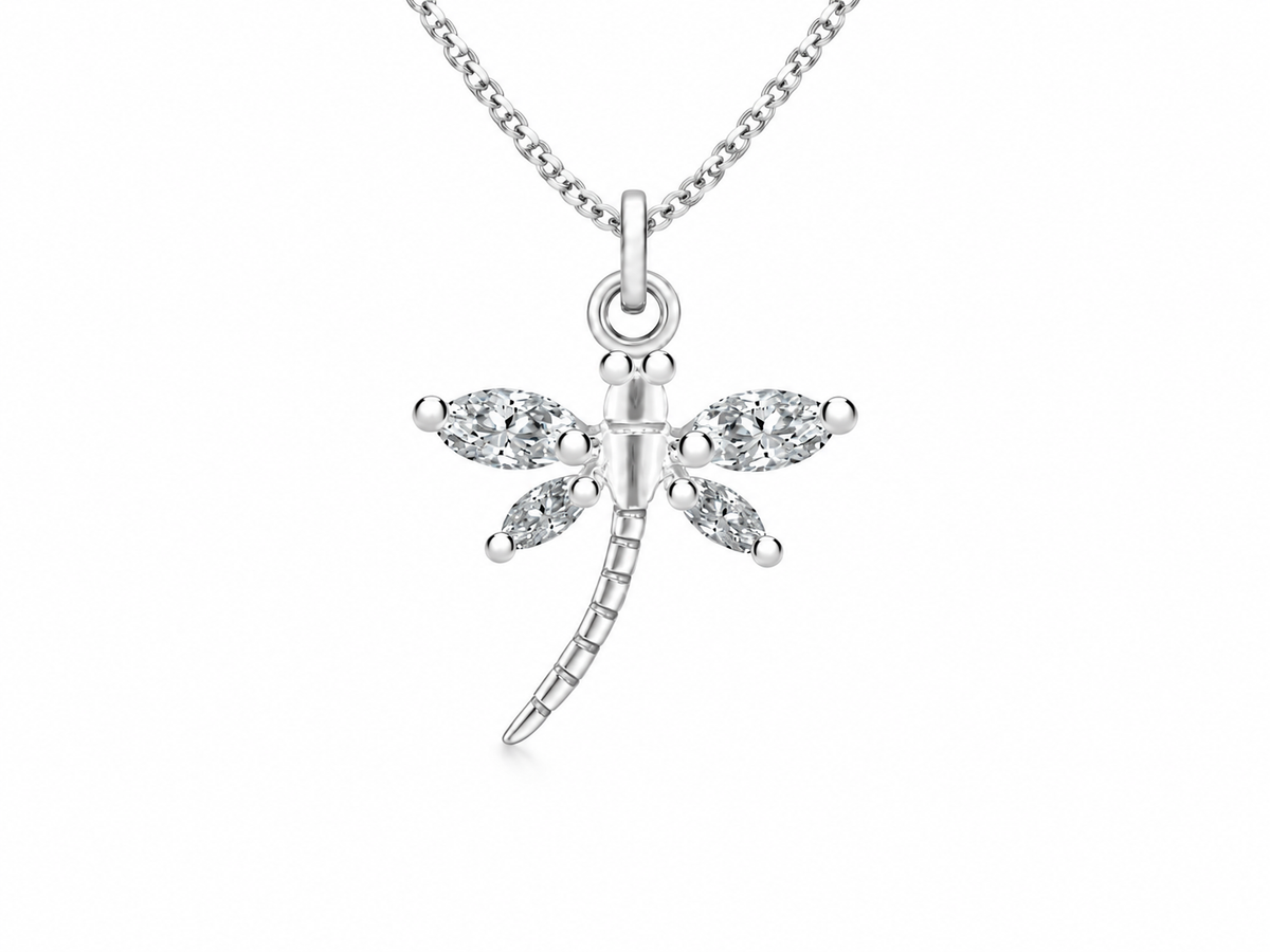 A silver dragonfly pendant necklace with clear marquise-cut gemstones on the wings, suspended from a delicate silver chain against a plain white background.

