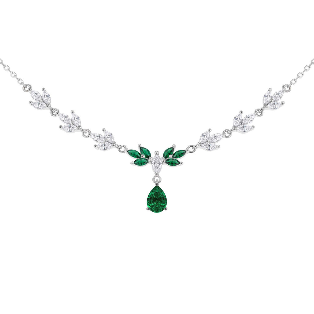 Silver-toned necklace featuring a leafy chain design with clear stones and a central green emerald pendant, shown on a plain white background.
